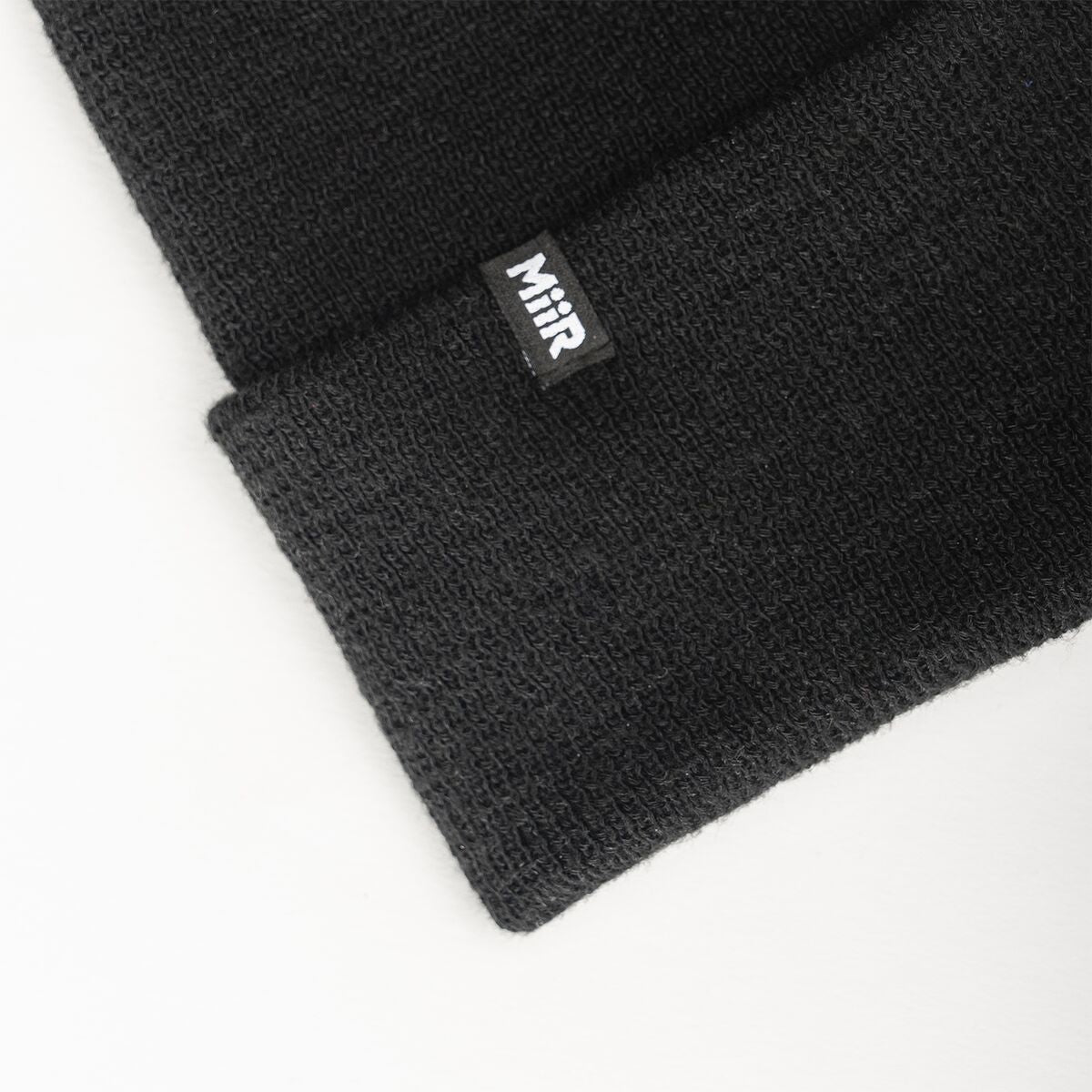 recycled-poly-fine-knit-beanie-q3 WebPDP-RecycledPolyFineKnitBeanie_Studio_TagDetail_Black__BNE005002OS.jpg
