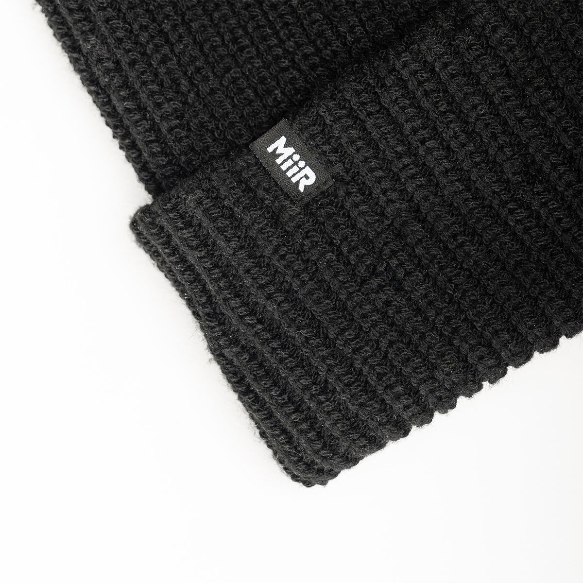 recycled-poly-rib-beanie-g3 WebPDP-RecycledPolyRibBeanie_Studio_TagDetail_Black__BNE002002OS.jpg
